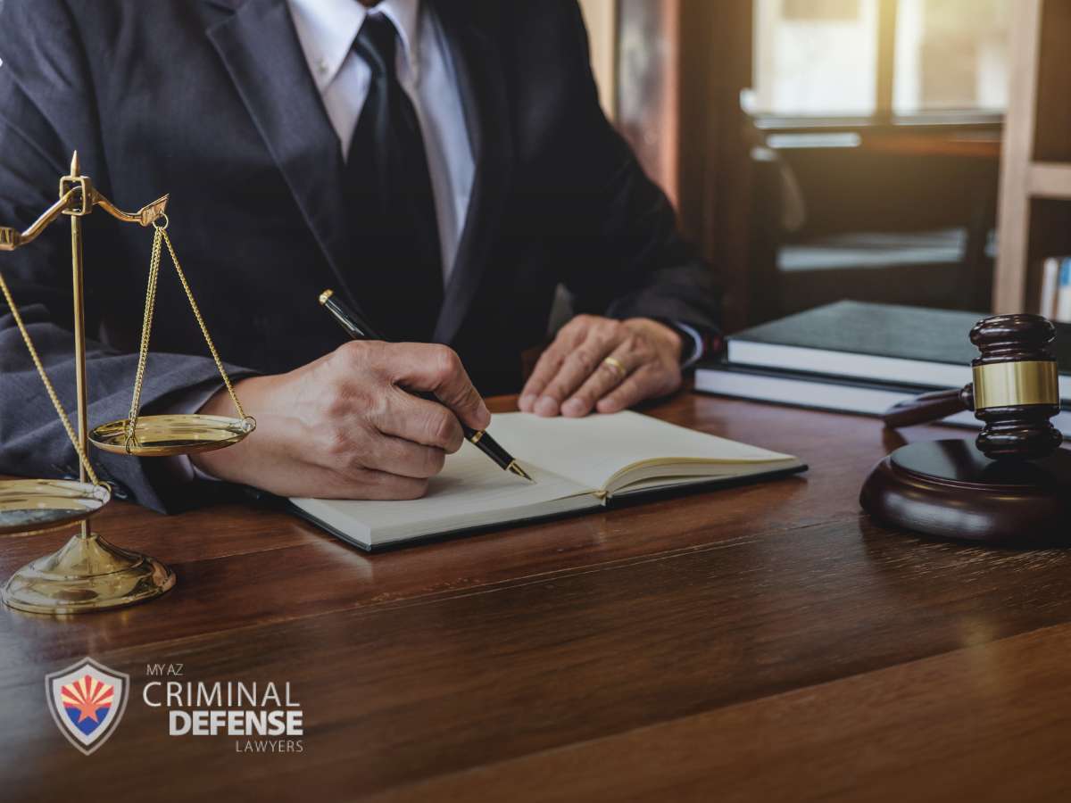 Defense attorney at work, symbolizing legal assistance for a Sealed Criminal Record In Arizona.