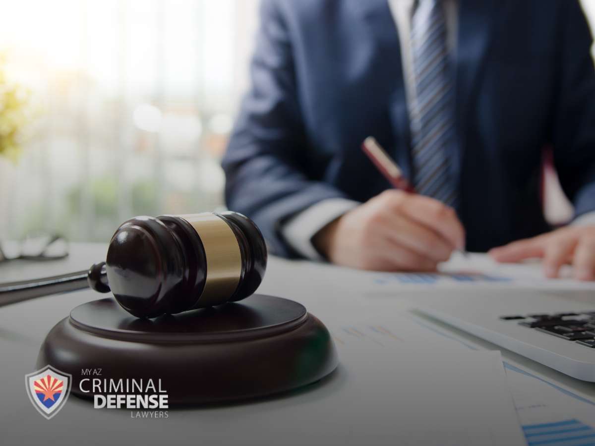 A lawyer working at a desk with a gavel, highlighting DUI rates