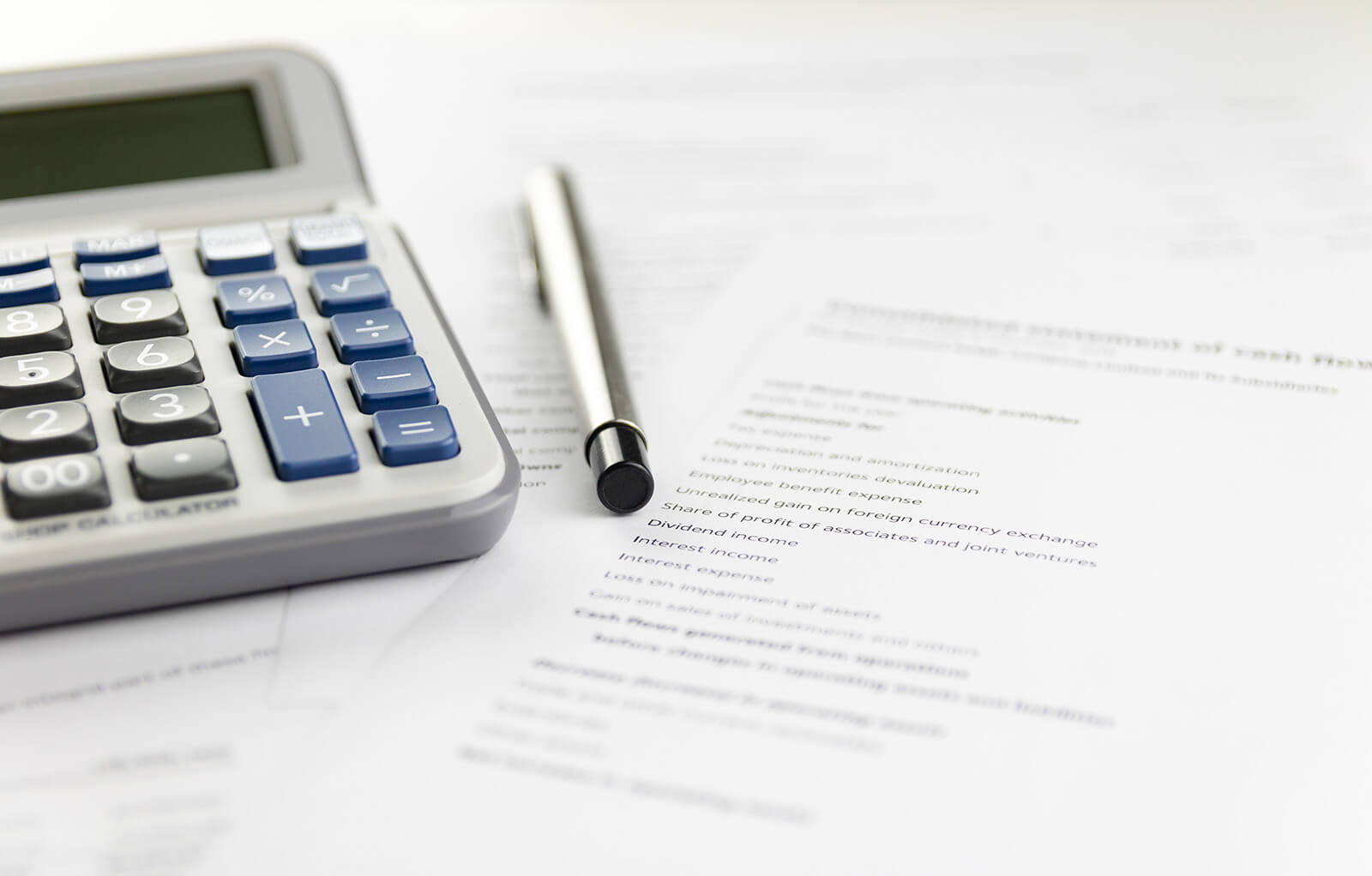 Calculator and financial statement representing juvenile fines and financial penalties in Arizona