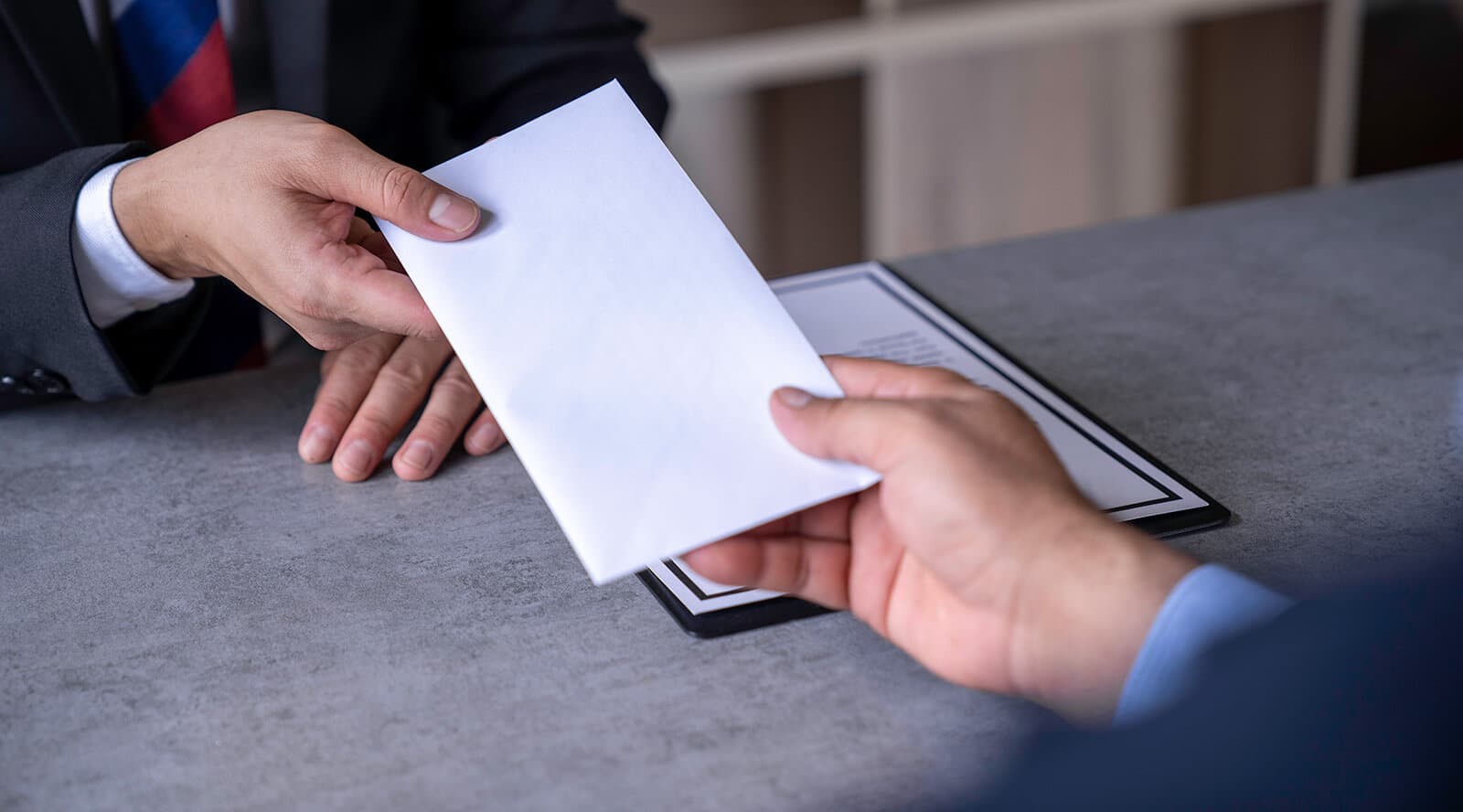 Handing over restitution payment envelope in Arizona juvenile reparation case