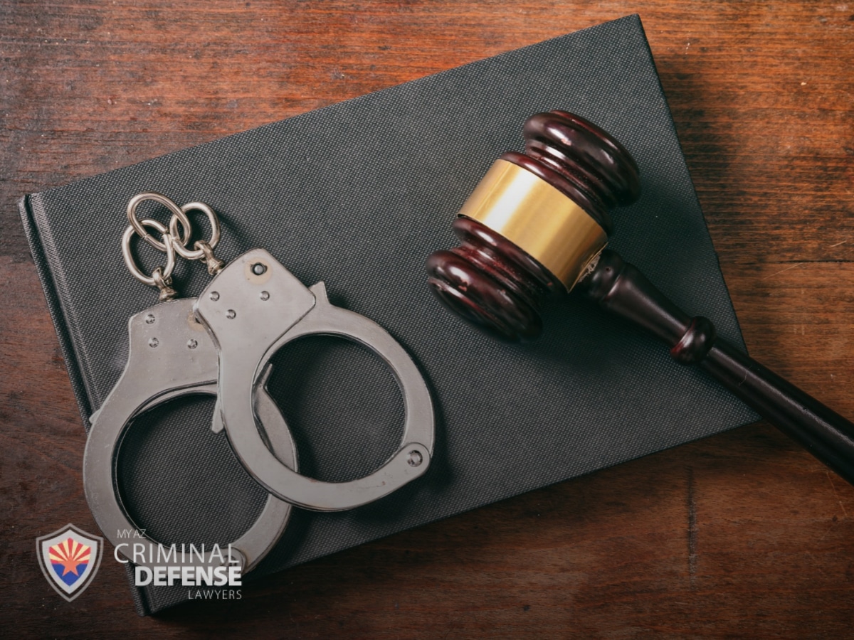 Criminal Damage In Arizona With Gavel and Handcuffs